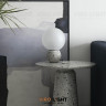 Дизайнерская настольная лампа EIGHT рядом с цветком